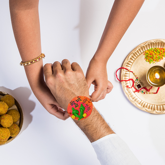 Handmade Customized Clay (Mere Bhai ko Nazar Na Lage Orange) Rakhi